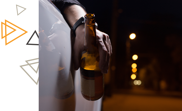 driver holding a beer