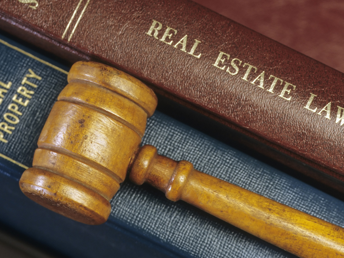  Real estate law books and gavel.