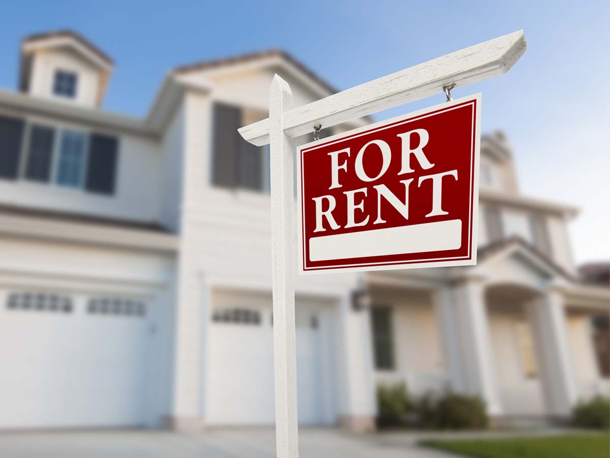 For sale sign in front of a property