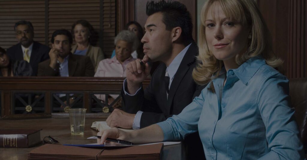 A couple of real estate lawyers inside the courtroom