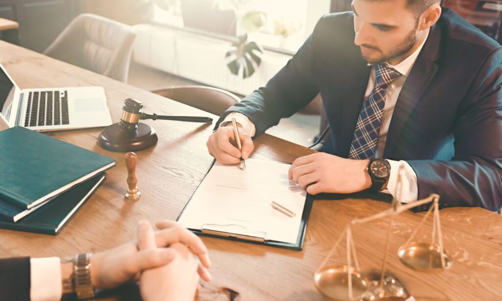 attorney reviewing paperwork with client