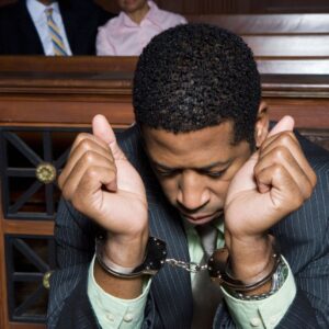 man in handcuffs in court