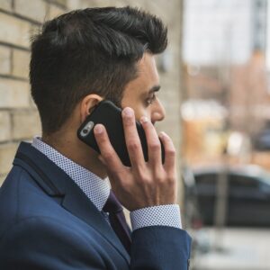 Person holding a smartphone to their ear
