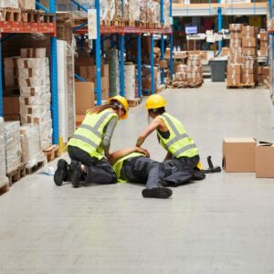 team of workers assisting fallen worker