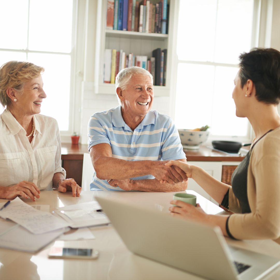 older couple speaking with younger woman