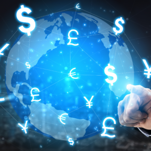 a person touching a globe with different types of foreign money flying around