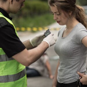 Woman getting breathalyzed