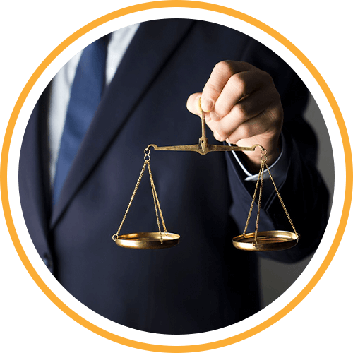 person in a suit holding the scales of justice