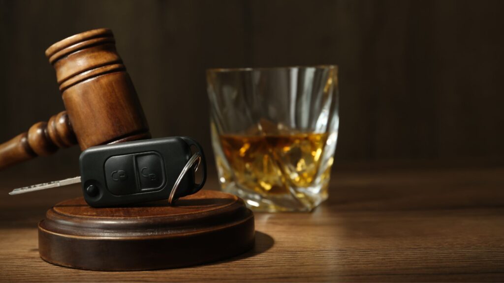 alcohol, car key, and gavel