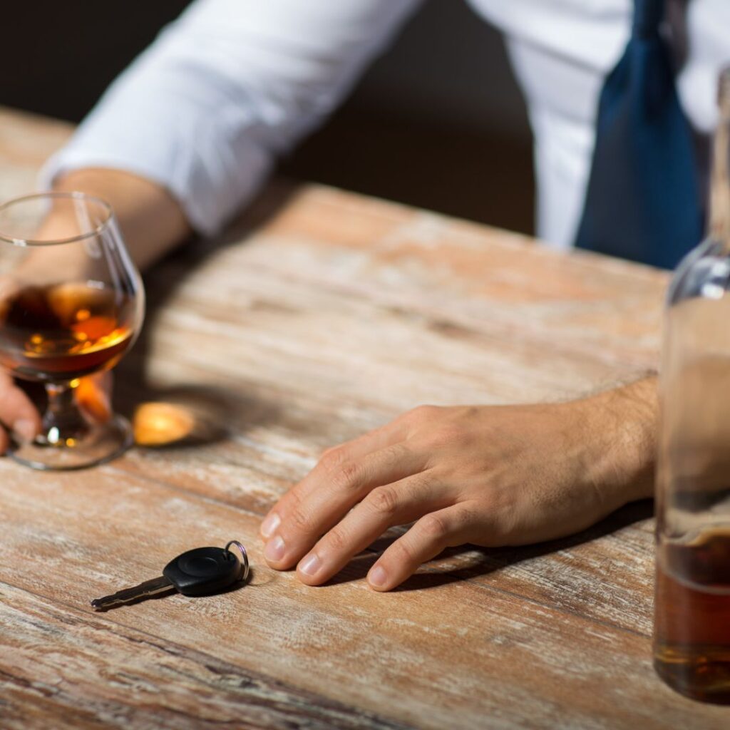 drunk man grabbing for keys