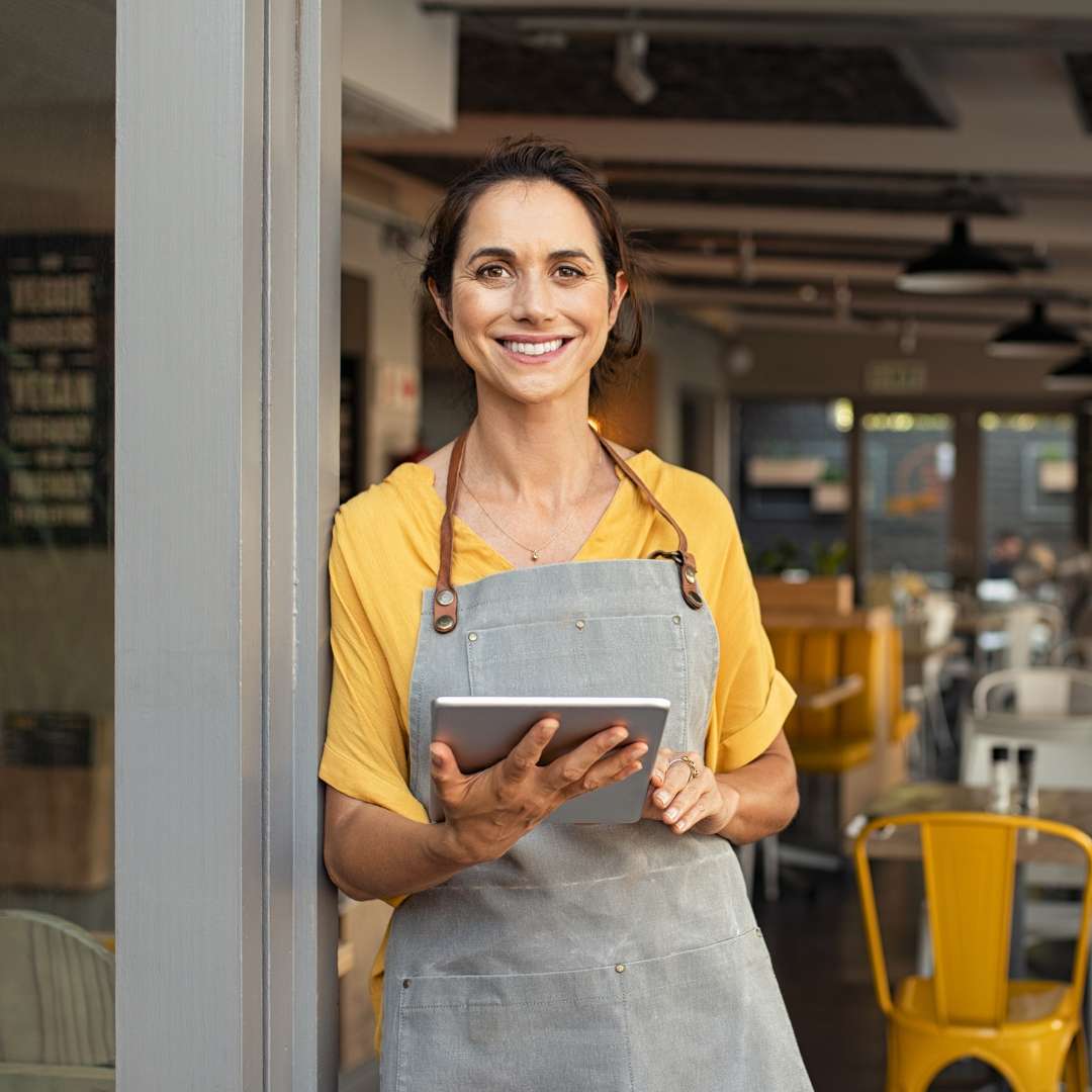 business owner holding tablet