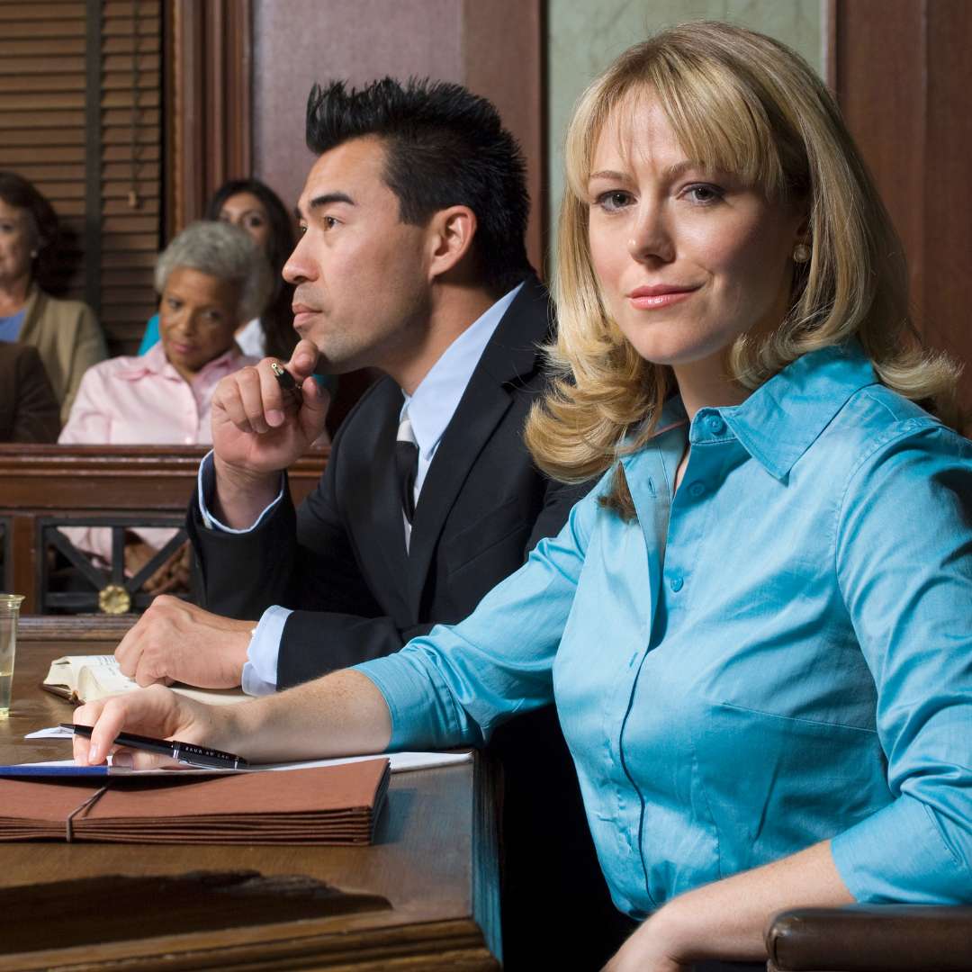 lawyer with client in court