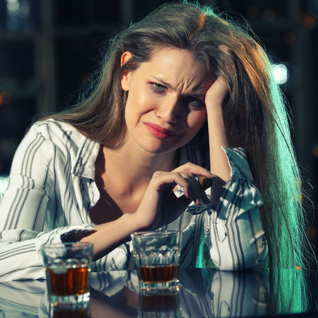 woman drinking and crying