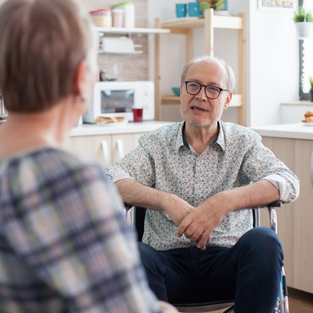Two older family members talking