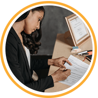 female writing on papers