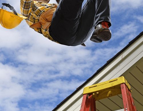 Construction worker falling from a red ladder.