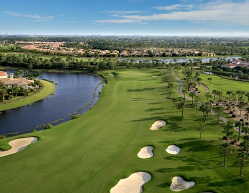 Aerial view of a golf course and residential community.