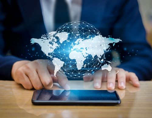 Global network graphic glowing over a smartphone.