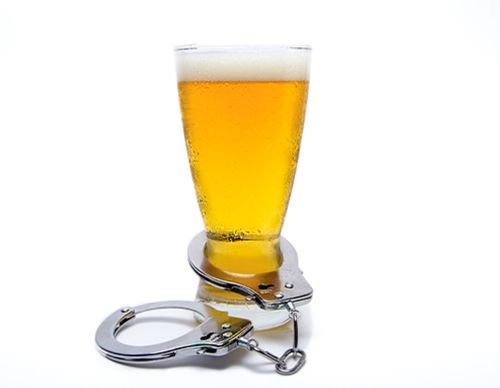 beer glass with handcuffs around it